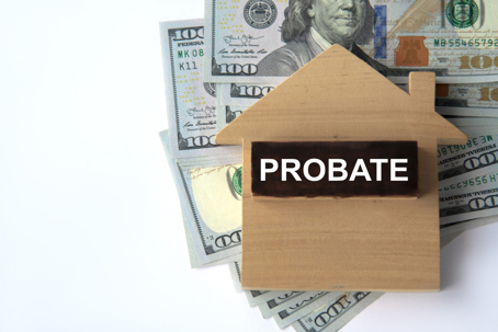 PROBATE - word on a wooden block on a white background with banknotes and a wooden house